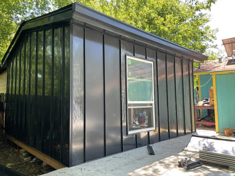 Black standing seam metal wall panels for Metal Roof Installation in Brandon